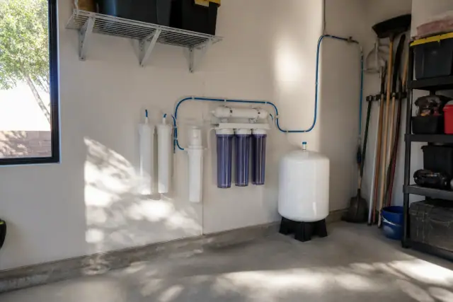 Reverse osmosis water filtration system installed on a garage wall in Mesa, AZ.