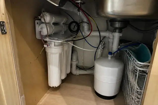 Reverse osmosis water filtration system installed under a kitchen sink in a home in Mesa, AZ.