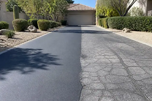 Freshly repaired asphalt driveway in a residential neighborhood in Scottsdale, AZ.