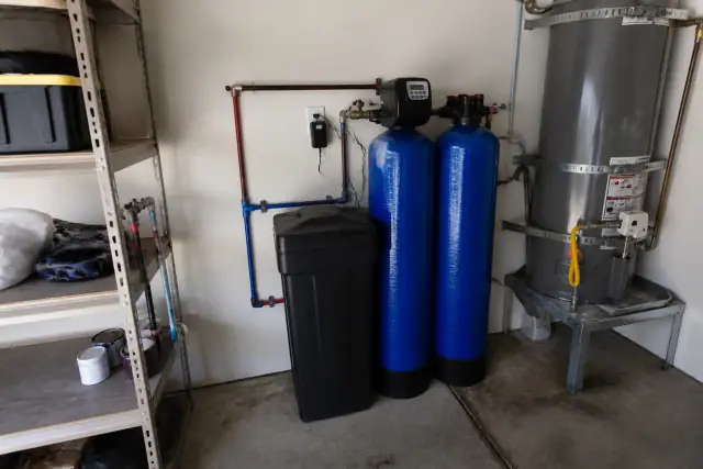 Water softener and carbon filtration system installed in a residential garage in Glendale, AZ.