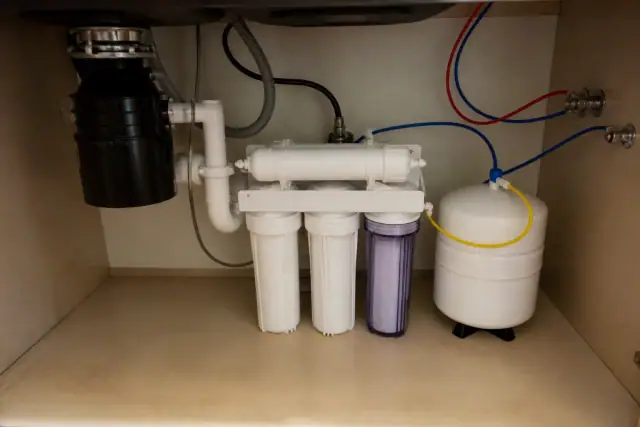 Reverse osmosis water filtration system installed under a laundry room sink in Tempe, AZ.