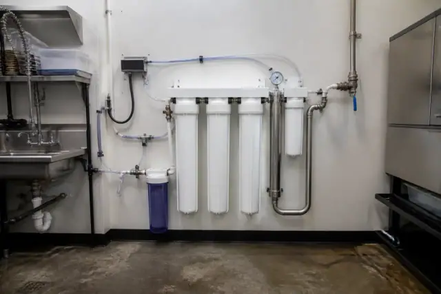 Commercial reverse osmosis water filtration system installed in a restaurant utility room in Tempe, AZ.