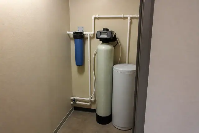 Water softener and filtration system installed in a utility closet in Gilbert, AZ.