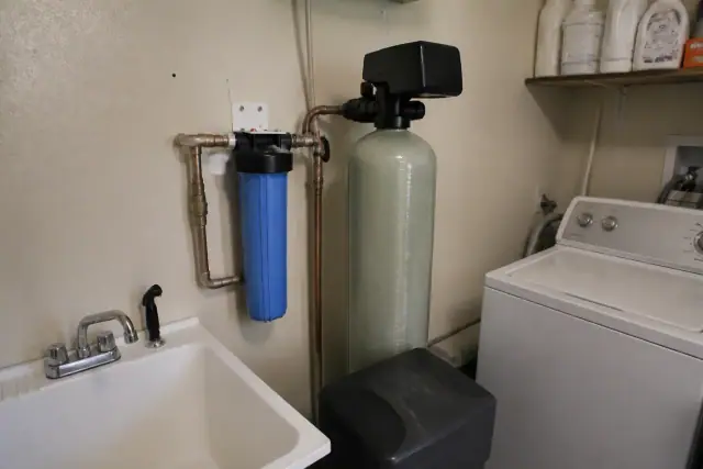 Water softener system installed in a laundry room in Tempe, AZ.