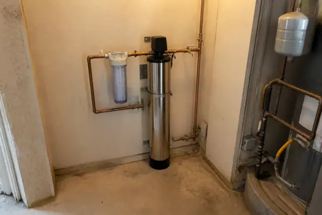 Stainless steel water filtration system with copper piping installed in a mechanical room in Scottsdale, AZ.