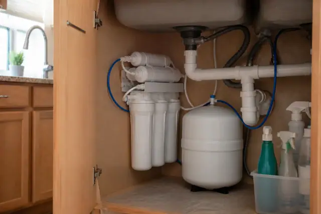 Reverse osmosis filtration system installed under a kitchen sink in a home in Phoenix, AZ.