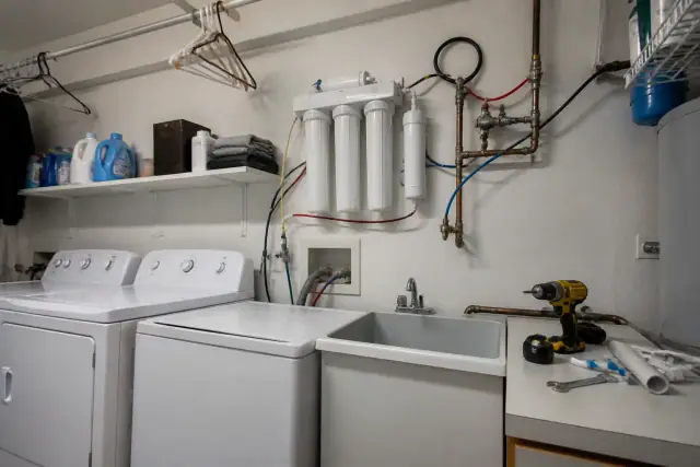 Reverse osmosis water filtration system installed on a laundry room wall in Tempe, AZ.