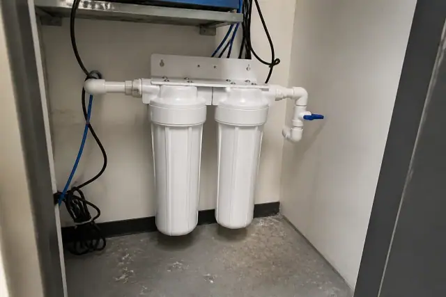 New sediment and carbon water filters installed in a utility closet in Tempe, AZ.