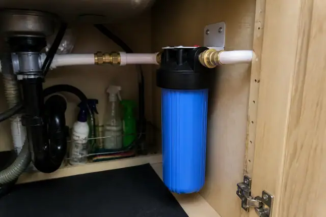 New sediment water filter installed under a kitchen sink in a Tempe, AZ home.