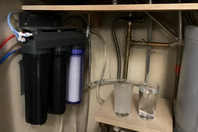 Reverse osmosis water filtration system installed in a utility closet in Tempe, AZ.